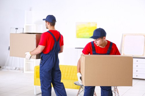 Man with a van moving items into a vehicle