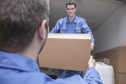 Local removals van in Woolwich handling furniture and boxes