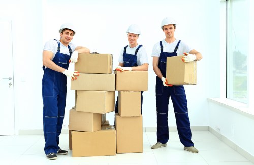 Packed moving boxes and protective materials ready for collection