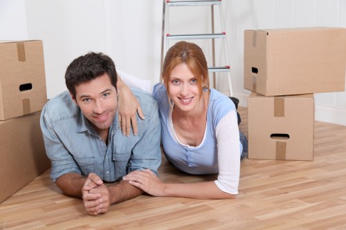 Local moving team handling packing in a Woolwich apartment building