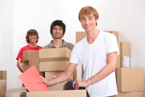 Professional moving van loading boxes and furniture in Woolwich