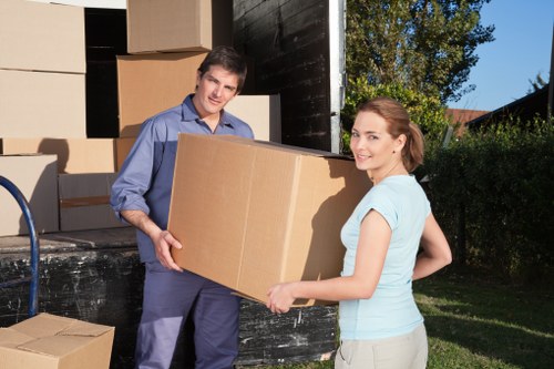 Local movers handling boxes and furniture in Woolwich