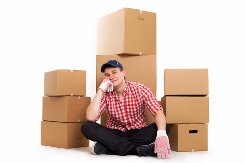 Loading household boxes and furniture into a van in Woolwich